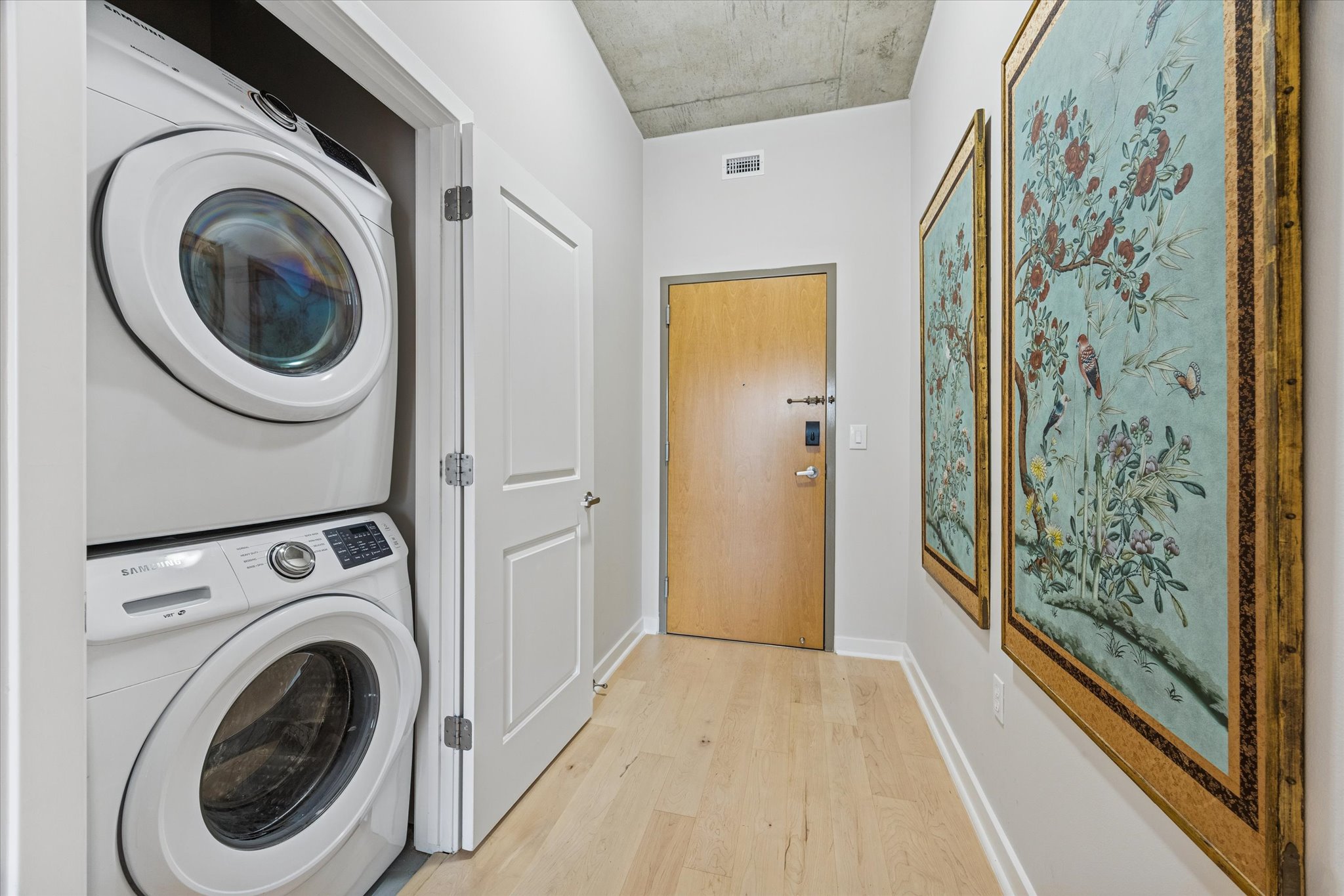 360 Nueces Street, Unit 1417 Austin, TX 78701 - Photo 26 of 39 a view of a hallway with washer and dryer