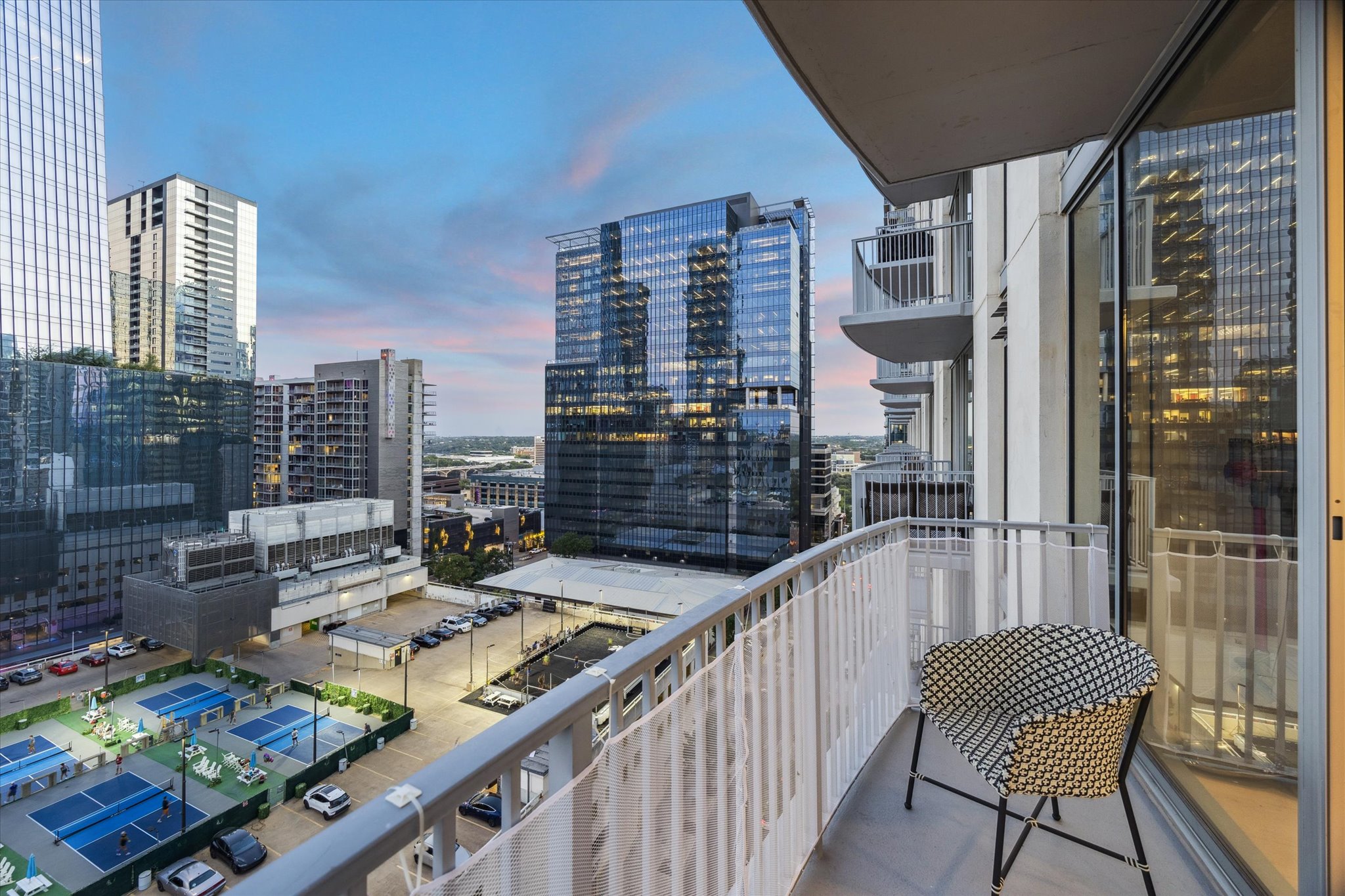 360 Nueces Street, Unit 1417 Austin, TX 78701 - Photo 8 of 39 a balcony view with couple of chairs