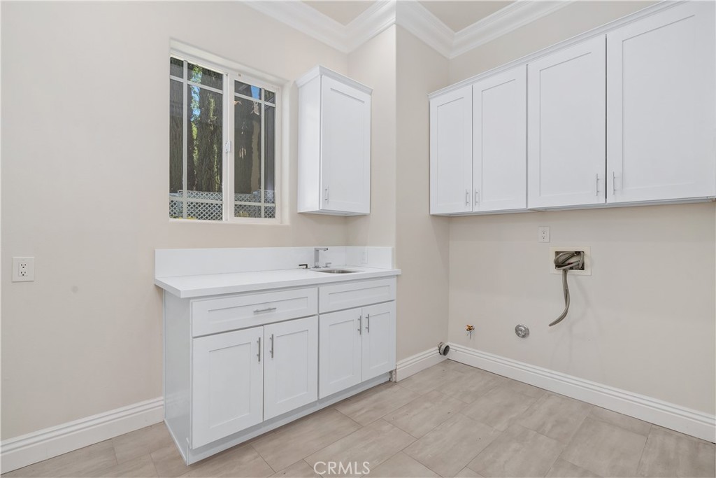 166 Dapplegray Road Bell Canyon, CA 91307 - Photo 17 of 57 a room view with a sink and cabinets