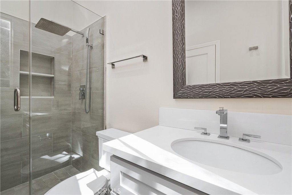 166 Dapplegray Road Bell Canyon, CA 91307 - Photo 20 of 57 a bathroom with a sink toilet and shower