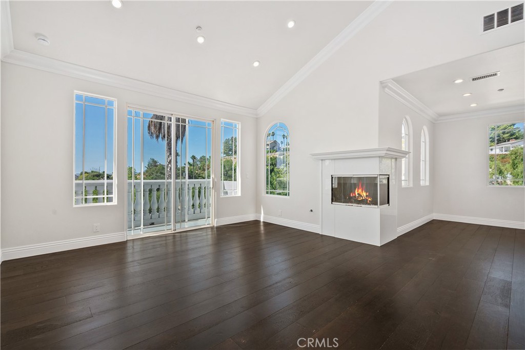 166 Dapplegray Road Bell Canyon, CA 91307 - Photo 21 of 57 an empty room with wooden floor and a fireplace