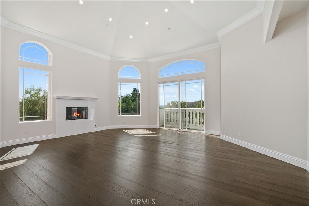 166 Dapplegray Road Bell Canyon, CA 91307 - Photo 28 of 57 a view of an empty room with wooden floor and a window