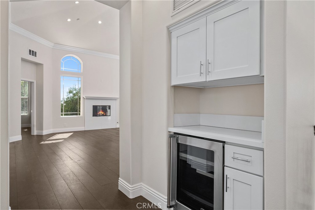 166 Dapplegray Road Bell Canyon, CA 91307 - Photo 29 of 57 an entryway with wooden floor cabinet and a window