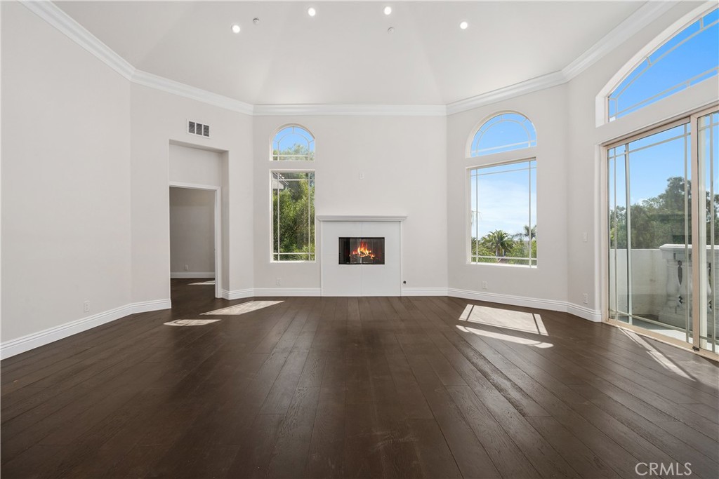166 Dapplegray Road Bell Canyon, CA 91307 - Photo 30 of 57 an empty room with wooden floor and a window