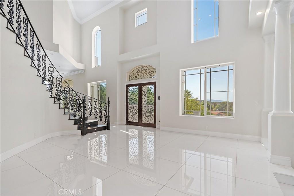 166 Dapplegray Road Bell Canyon, CA 91307 - Photo 3 of 57 a view of entryway with stairs and a window