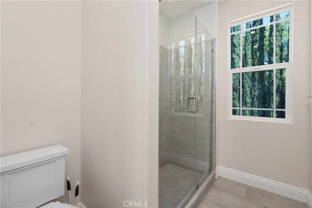 166 Dapplegray Road Bell Canyon, CA 91307 - Photo 33 of 57 a bathroom with a shower and a toilet