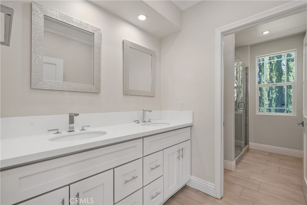 166 Dapplegray Road Bell Canyon, CA 91307 - Photo 34 of 57 a bathroom with 2 sink and a mirror