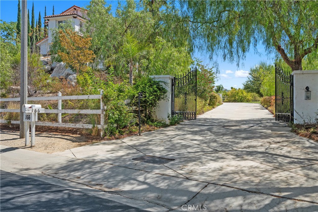 166 Dapplegray Road Bell Canyon, CA 91307 - Photo 51 of 57 a backyard of a house with plants and trees