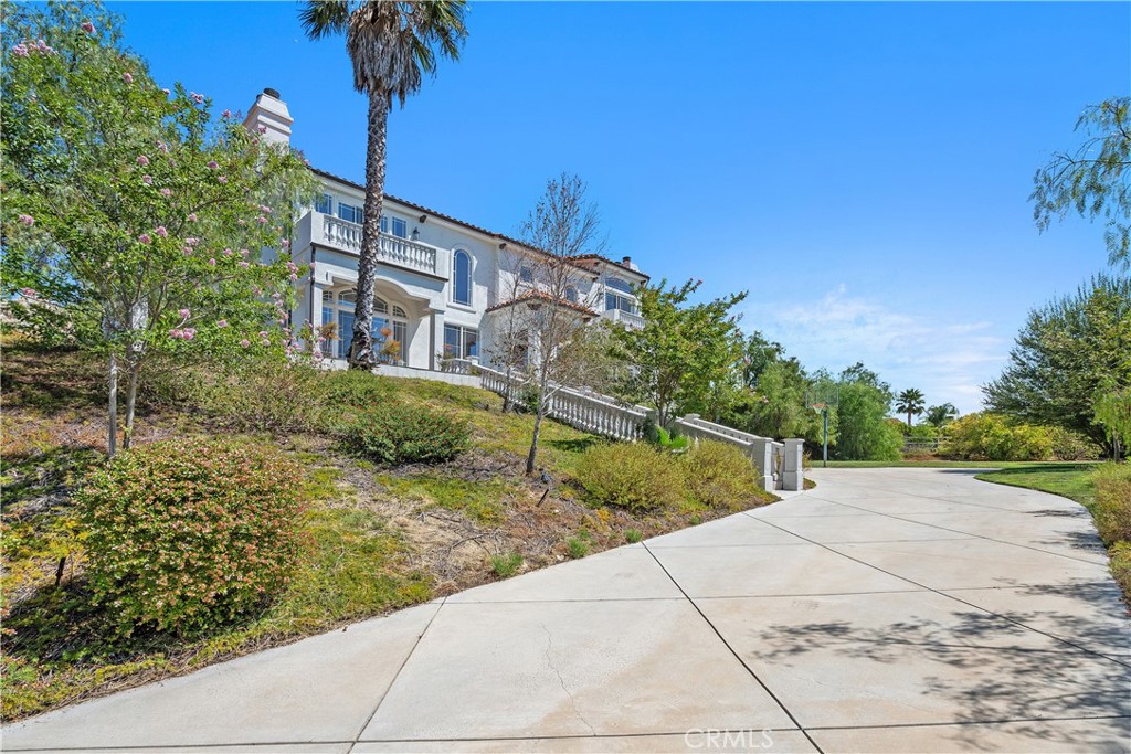 166 Dapplegray Road Bell Canyon, CA 91307 - Photo 52 of 57 a view of a house with a yard