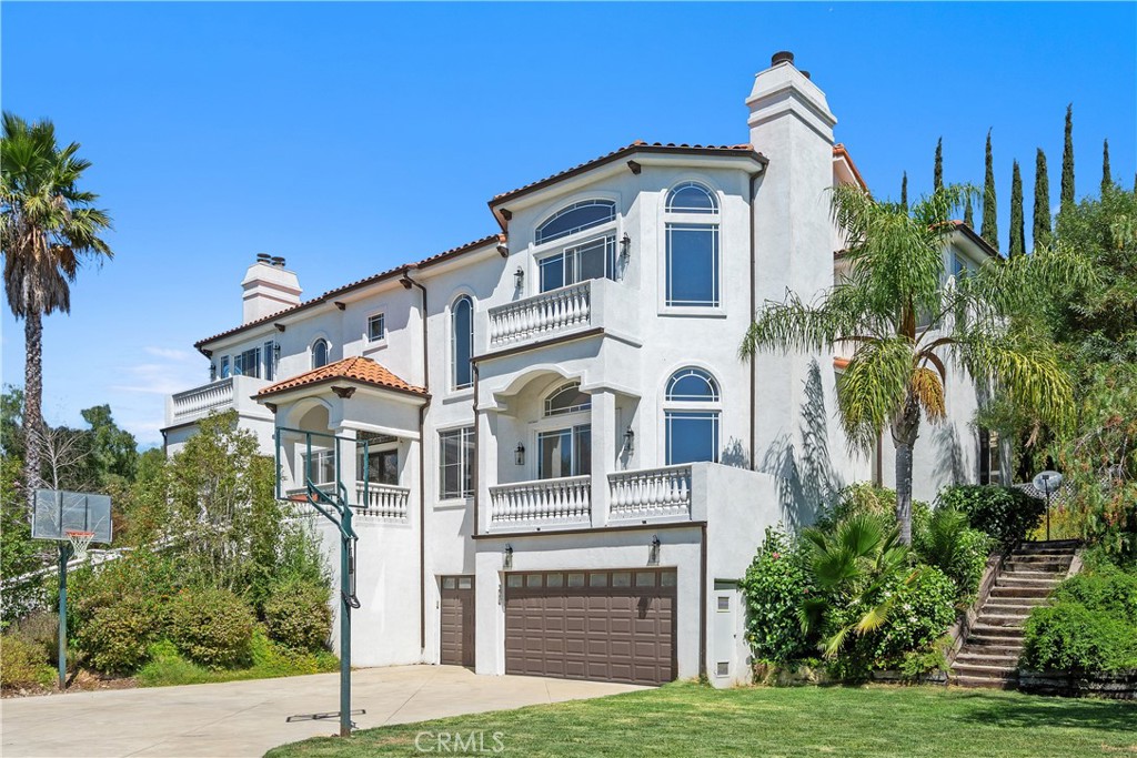 166 Dapplegray Road Bell Canyon, CA 91307 - Photo 55 of 57 a front view of a house with a yard