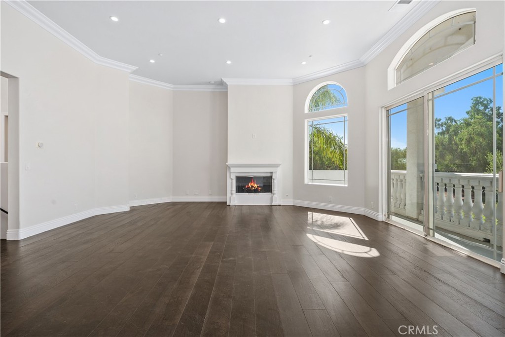 166 Dapplegray Road Bell Canyon, CA 91307 - Photo 8 of 57 a view of an empty room with wooden floor and a window