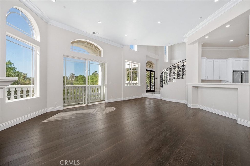 166 Dapplegray Road Bell Canyon, CA 91307 - Photo 10 of 57 a view of an empty room with wooden floor and a window