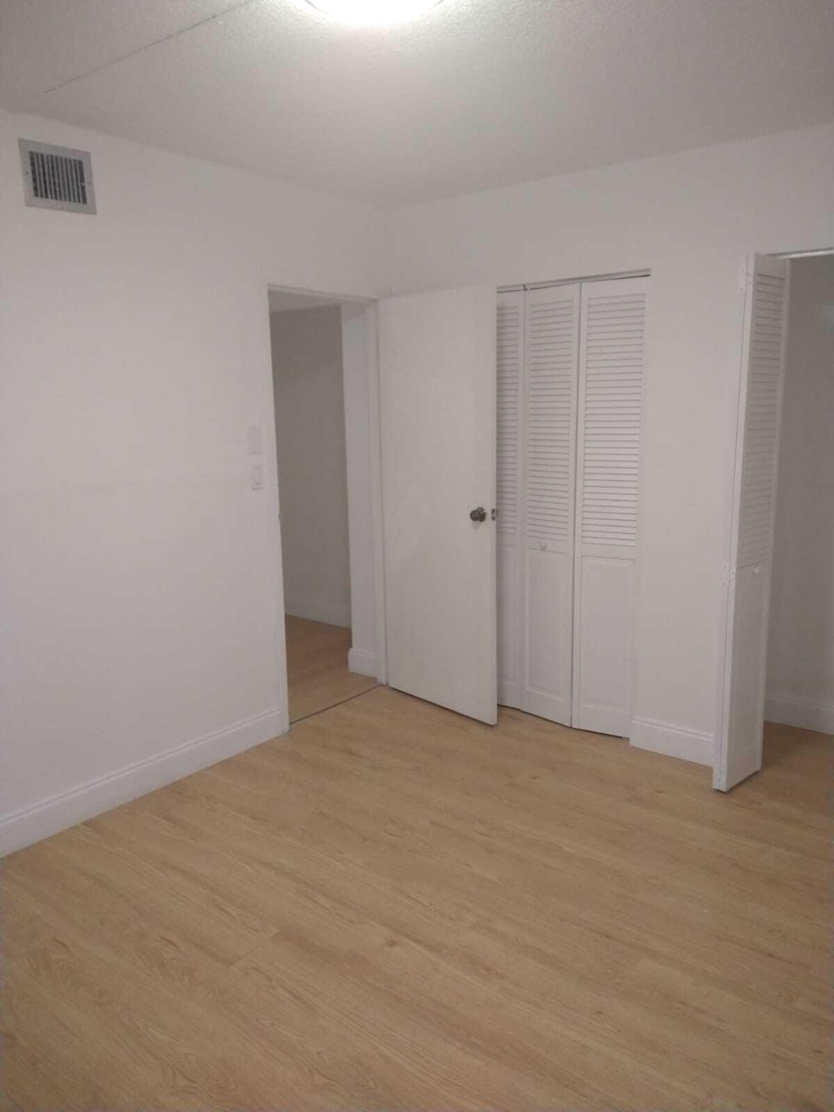 8321 Sands Point Boulevard, Unit D109 Tamarac, FL 33321 - Photo 11 of 16 a view of an empty room
