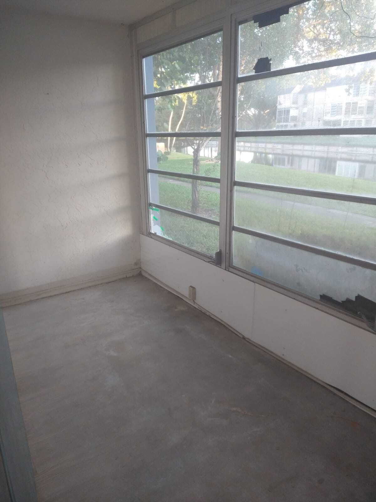8321 Sands Point Boulevard, Unit D109 Tamarac, FL 33321 - Photo 15 of 16 a view of empty room with window