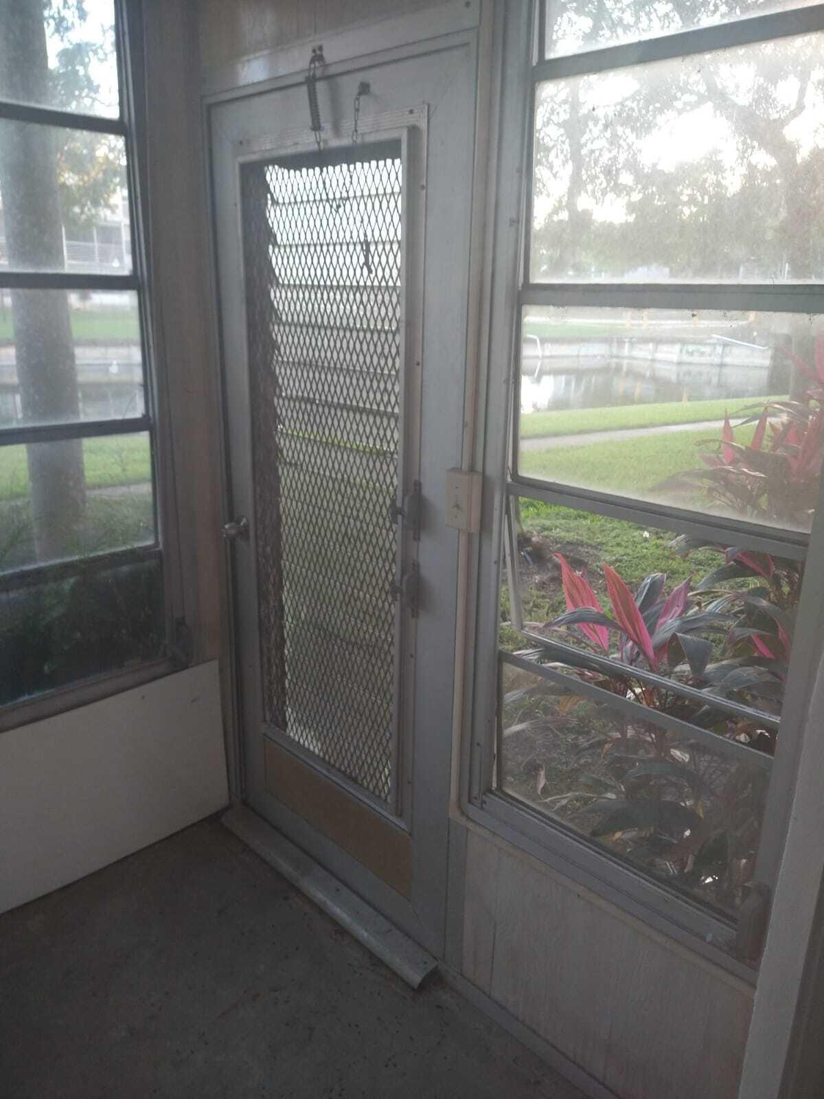 8321 Sands Point Boulevard, Unit D109 Tamarac, FL 33321 - Photo 16 of 16 a bathroom with a glass door and shower