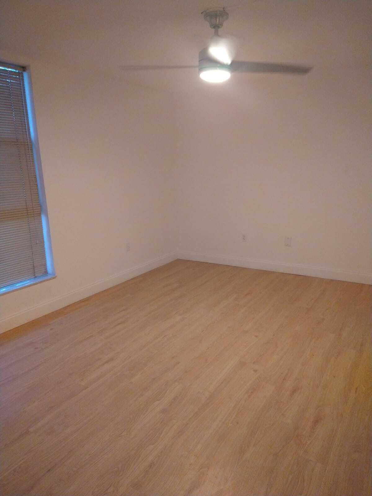 8321 Sands Point Boulevard, Unit D109 Tamarac, FL 33321 - Photo 8 of 16 a view of an empty room