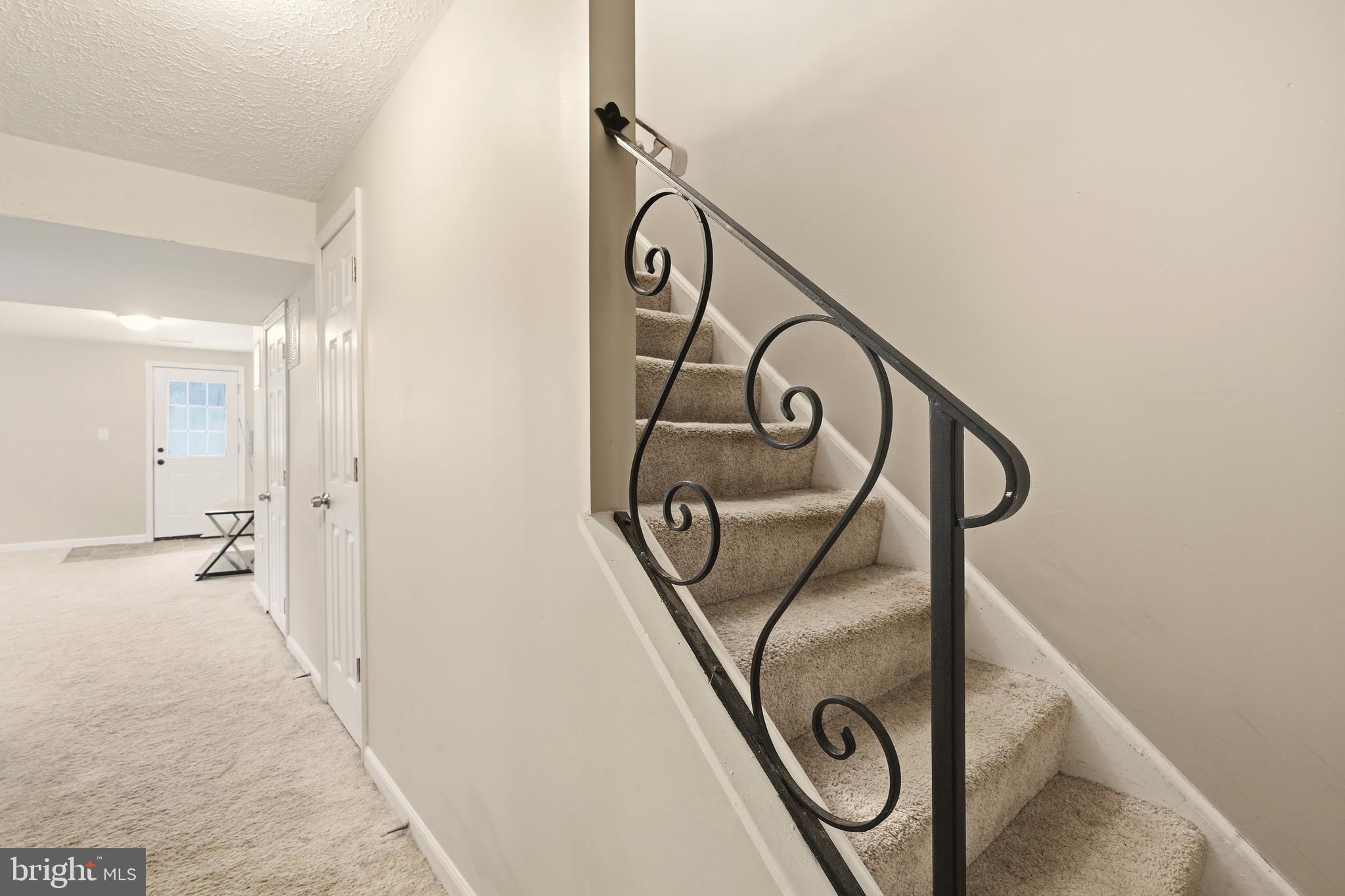 7712 Erica Lane Laurel, MD 20707 - Photo 13 of 35 a view of a entryway door with a couch