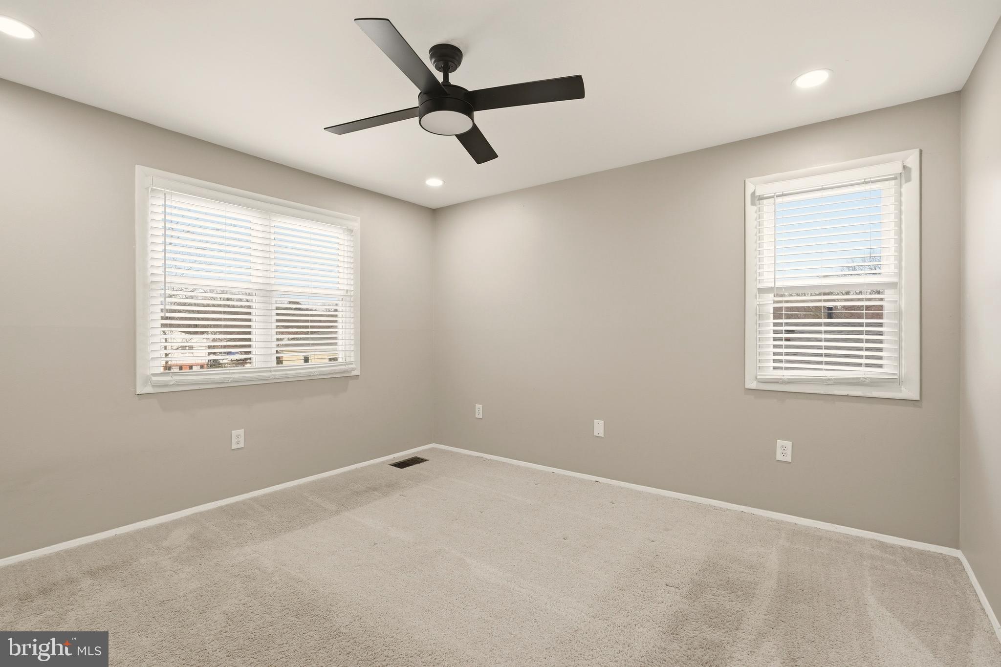 7712 Erica Lane Laurel, MD 20707 - Photo 15 of 35 a view of a big room with windows and ceiling fan