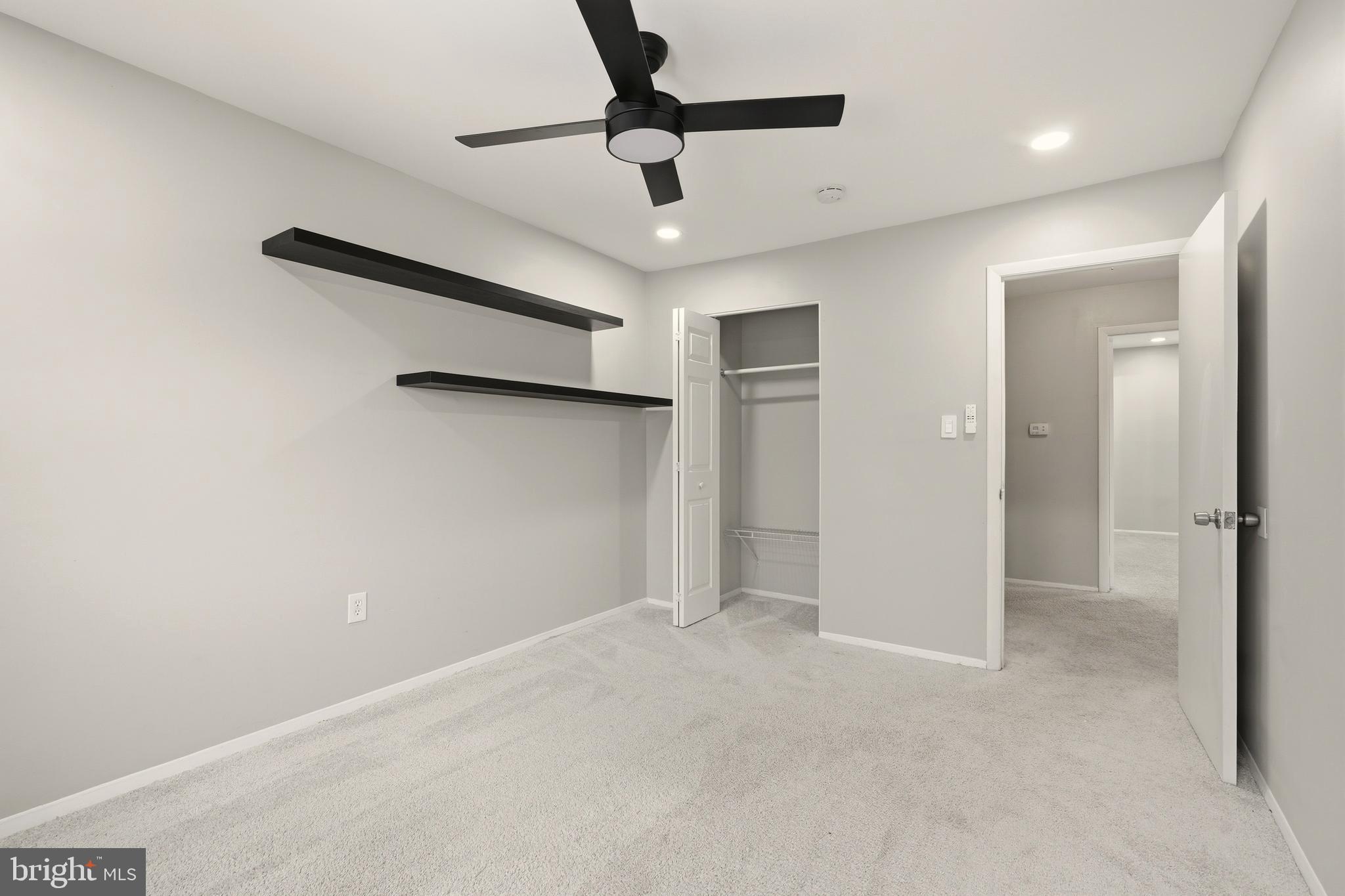 7712 Erica Lane Laurel, MD 20707 - Photo 17 of 35 an empty room with a ceiling fan