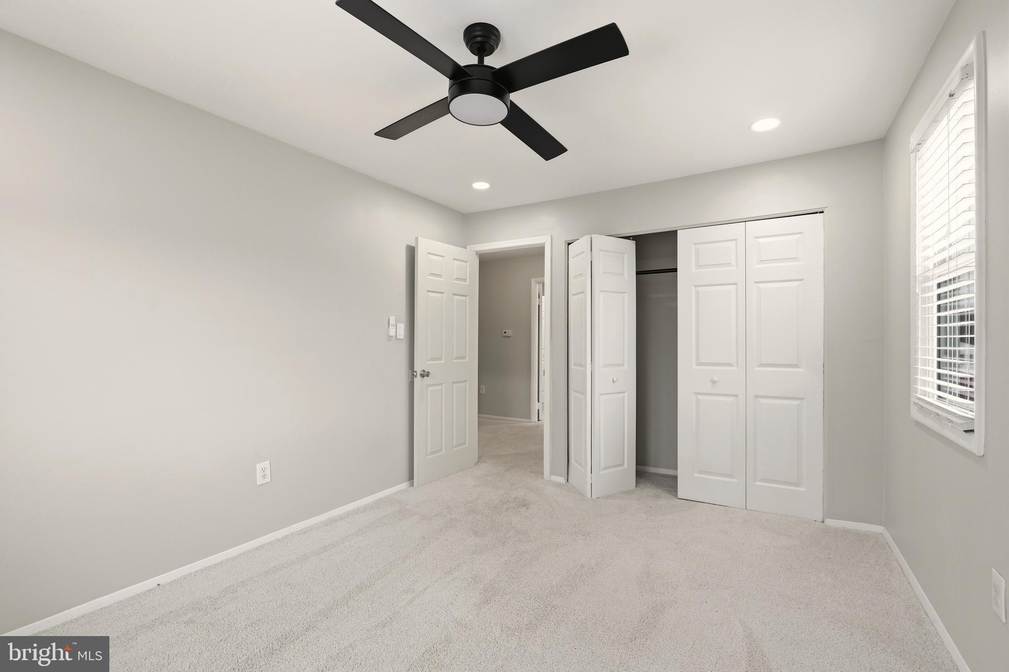 7712 Erica Lane Laurel, MD 20707 - Photo 21 of 35 a view of empty room with ceiling fan