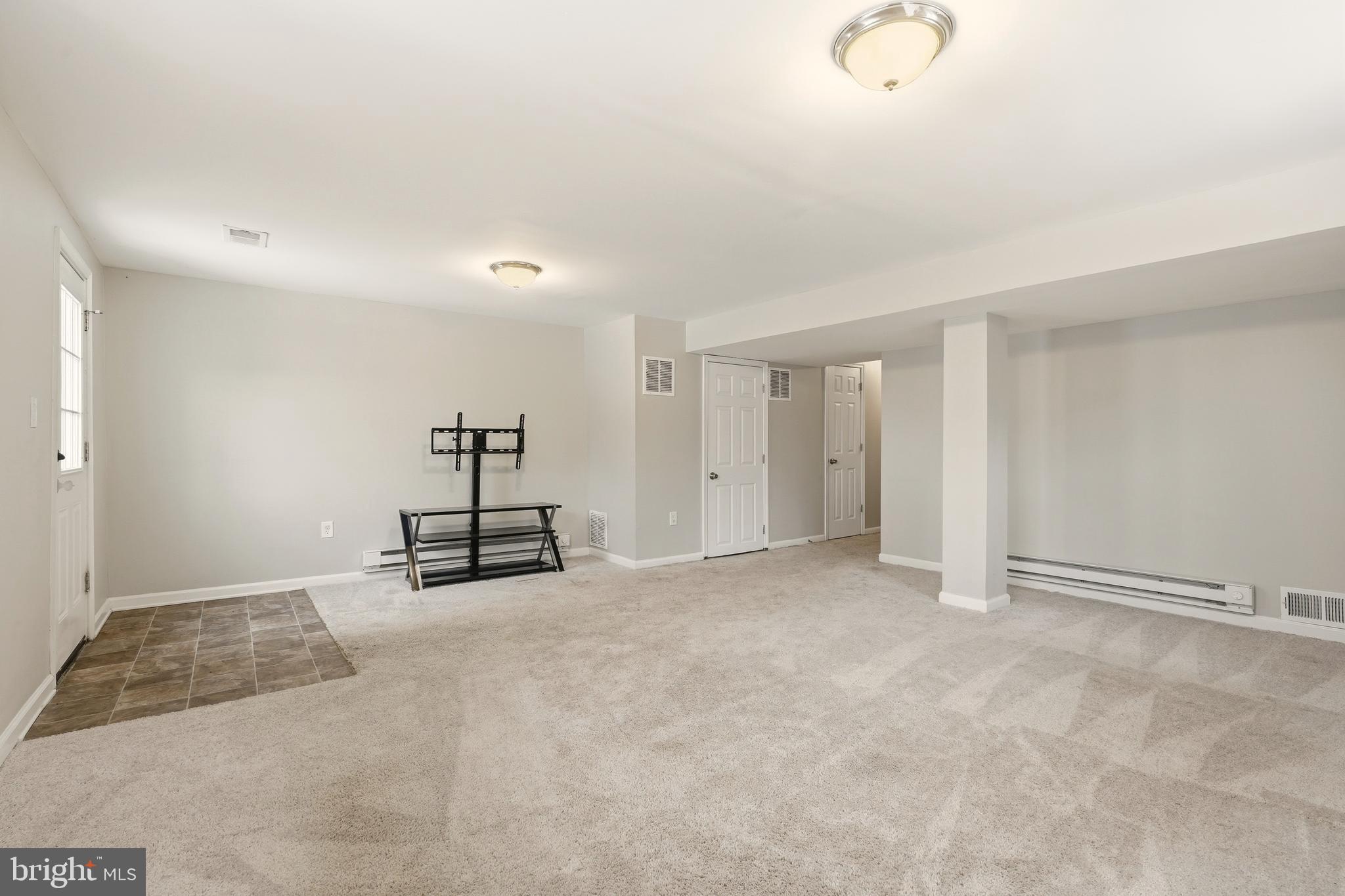 7712 Erica Lane Laurel, MD 20707 - Photo 25 of 35 an empty room with closet and mirrors