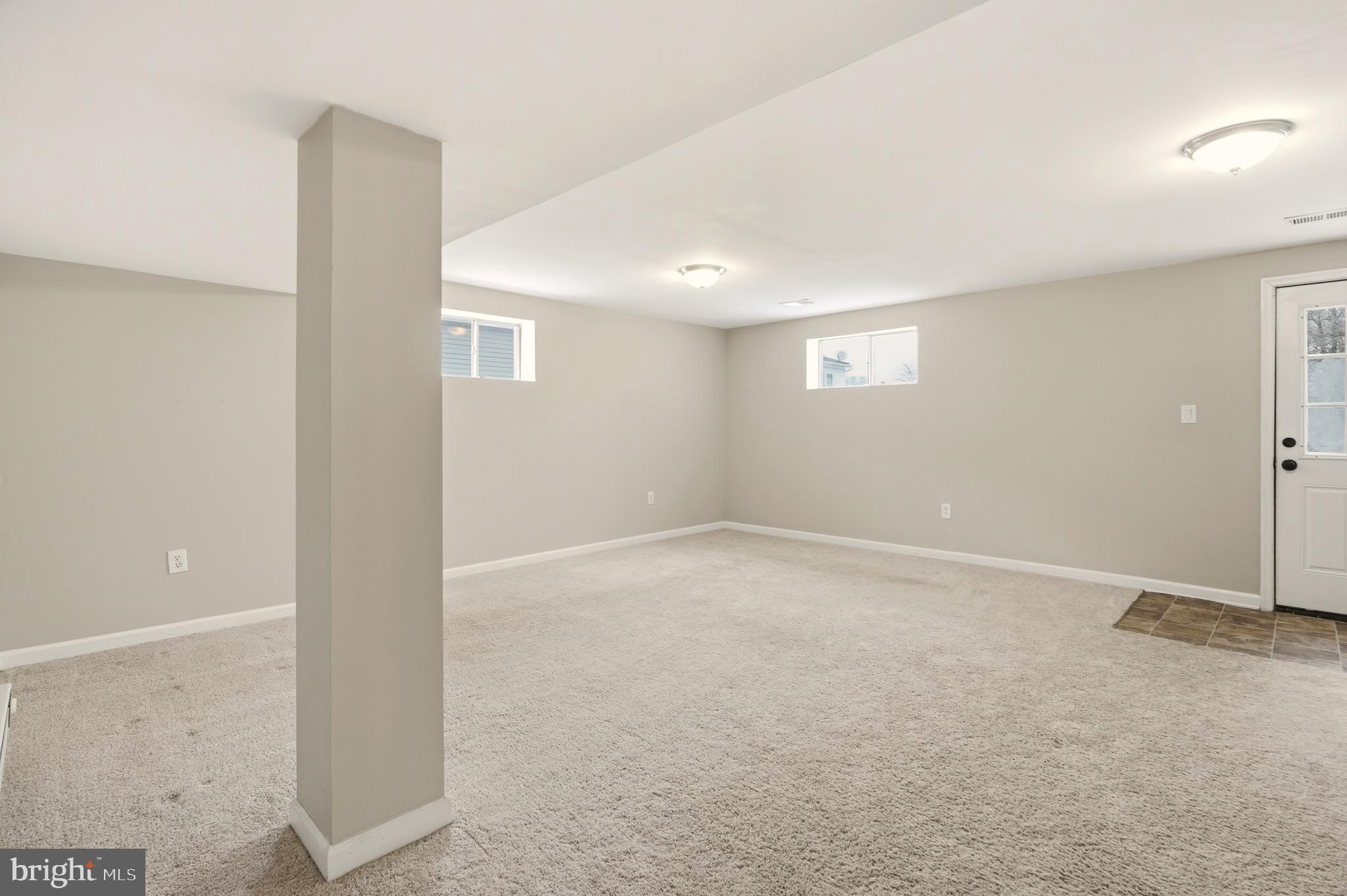 7712 Erica Lane Laurel, MD 20707 - Photo 26 of 35 an empty room with windows and entrance to other room