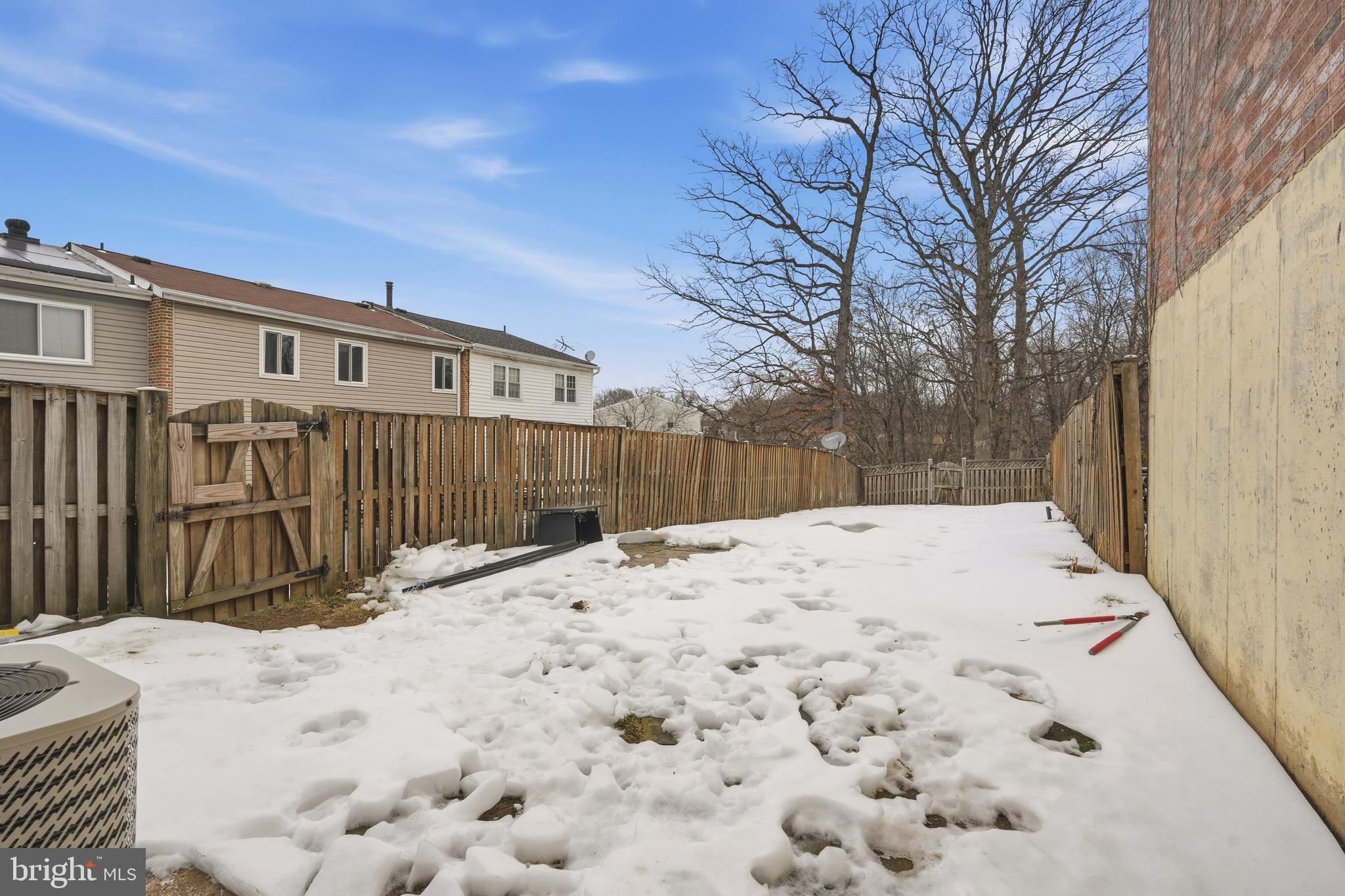 7712 Erica Lane Laurel, MD 20707 - Photo 32 of 35 a view of a house with a wooden fence