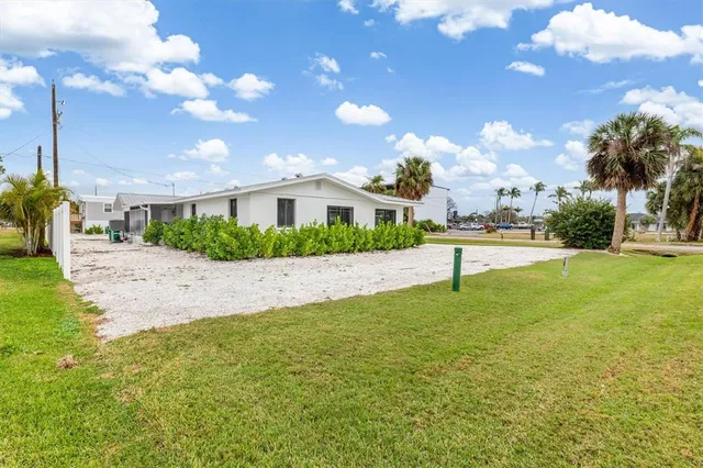 a house view with swimming pool and yard