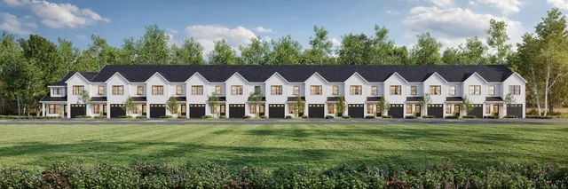 a view of a white house with a big yard and trees