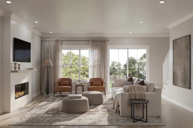 a living room with furniture a flat screen tv and a fireplace