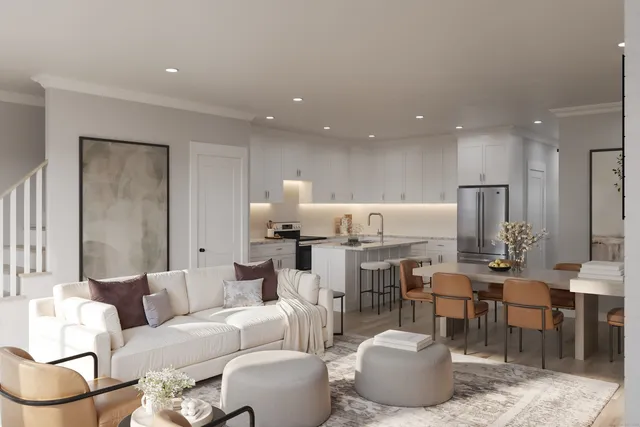 a living room with lots of furniture and white walls