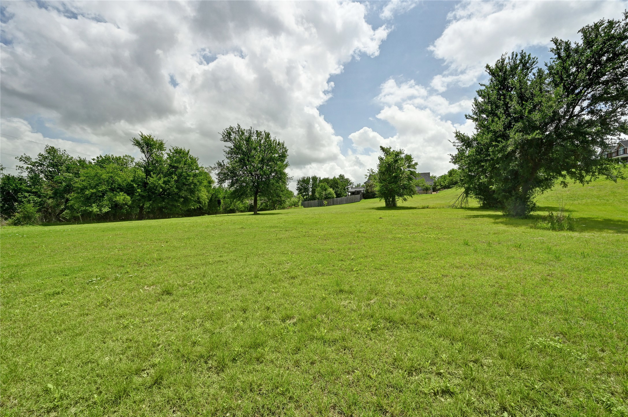 1700 Tanner Loop Taylor, TX 76574 - Photo 20 of 32 Expansive green space featuring a gently sloping terrain