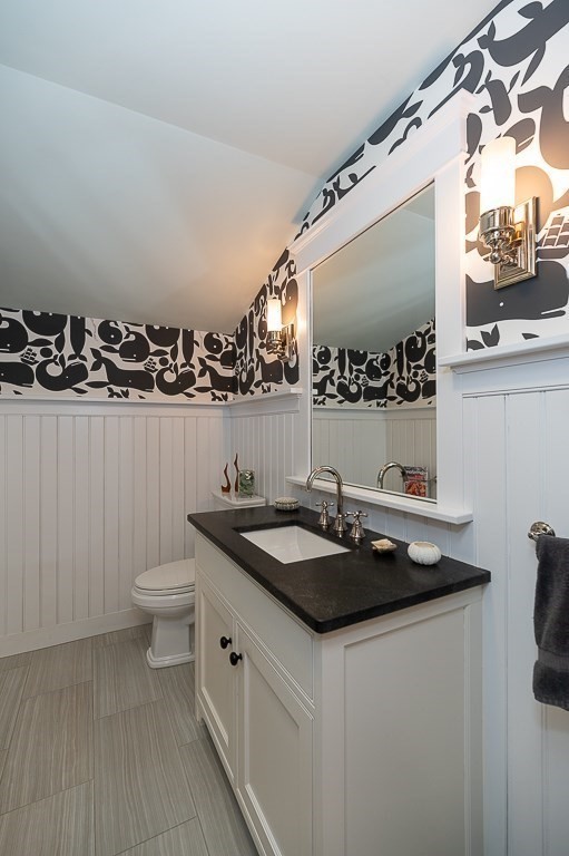 3 Grapevine Road Gloucester, MA 01930 - Photo 13 of 32 a bathroom with a granite countertop sink and a toilet