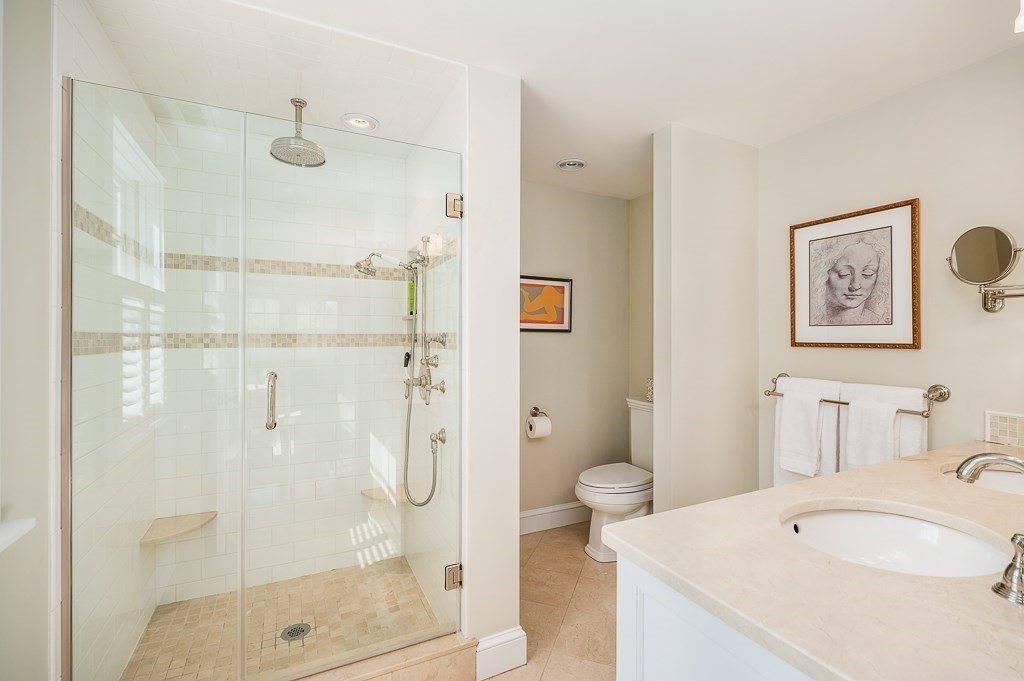 3 Grapevine Road Gloucester, MA 01930 - Photo 19 of 32 a bathroom with a sink and a mirror