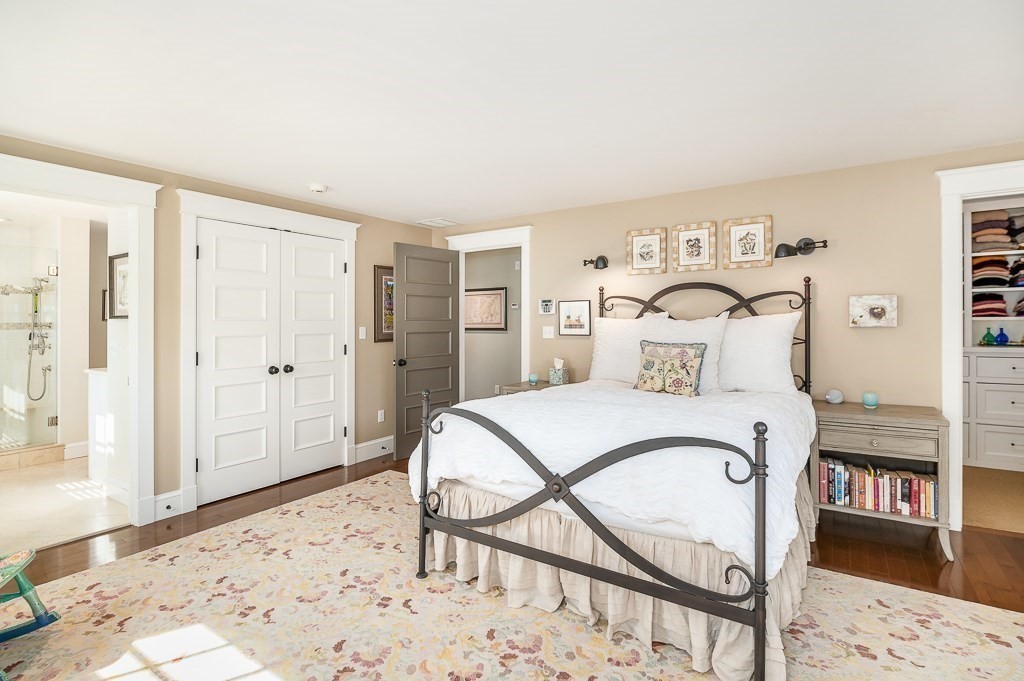 3 Grapevine Road Gloucester, MA 01930 - Photo 21 of 32 a bedroom with a bed and wooden floor