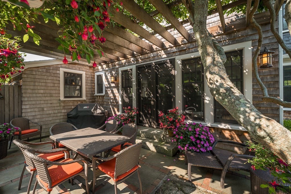 3 Grapevine Road Gloucester, MA 01930 - Photo 25 of 32 a view of a chairs and table in a patio