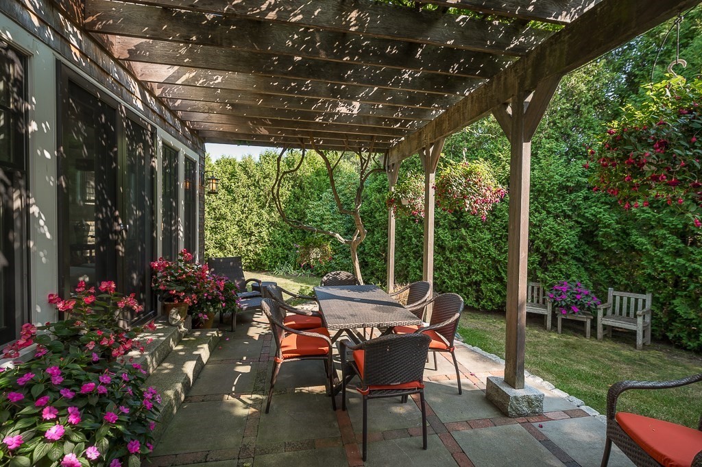 3 Grapevine Road Gloucester, MA 01930 - Photo 10 of 32 a view of a patio with a table chairs and a backyard