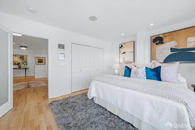 a bed room with a bed and a view of bathroom