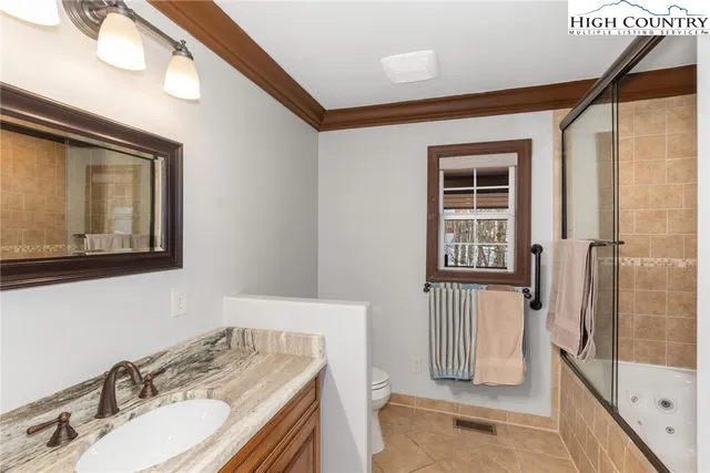 a bathroom with a bathtub and shower