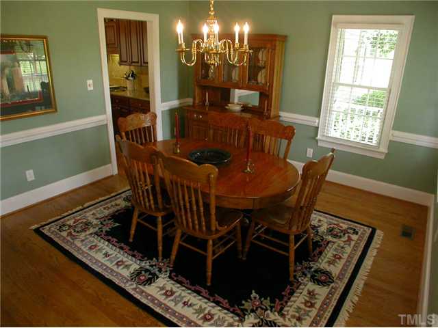 335 Pine Ridge Road Zebulon, NC 27597 - Photo 9 of 25 Gracious Separate Dining with Chair rail and Hardwood Floors
