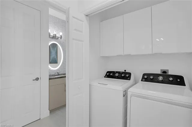 a view of storage and utility room with washer and dryer