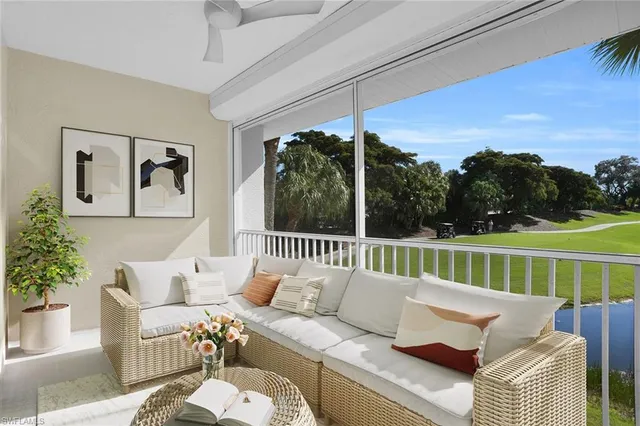 a balcony with furniture and a garden