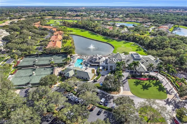 an aerial view of a house with a swimming pool yard and outdoor seating