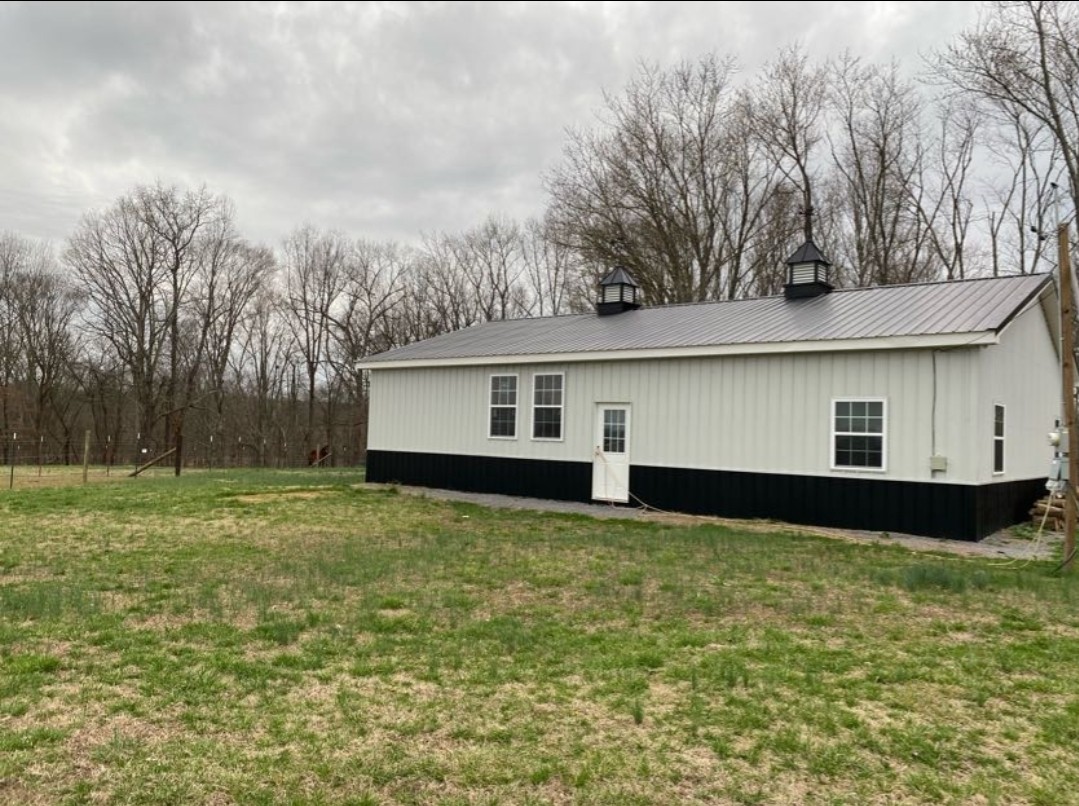5670 Pleasant View Road Morrison, TN 37357 - Photo 18 of 19 a front view of a house with garden