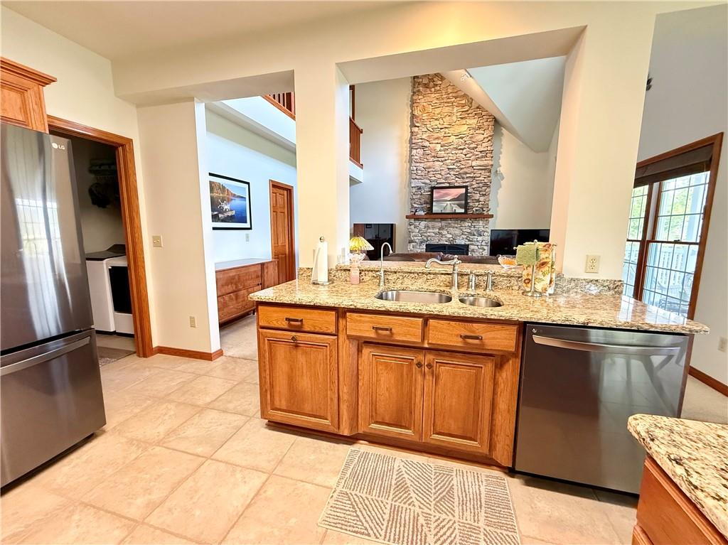 334 Manito Trail Mercer, PA 16137 - Photo 12 of 49 a kitchen with stainless steel appliances granite countertop a sink stove and refrigerator