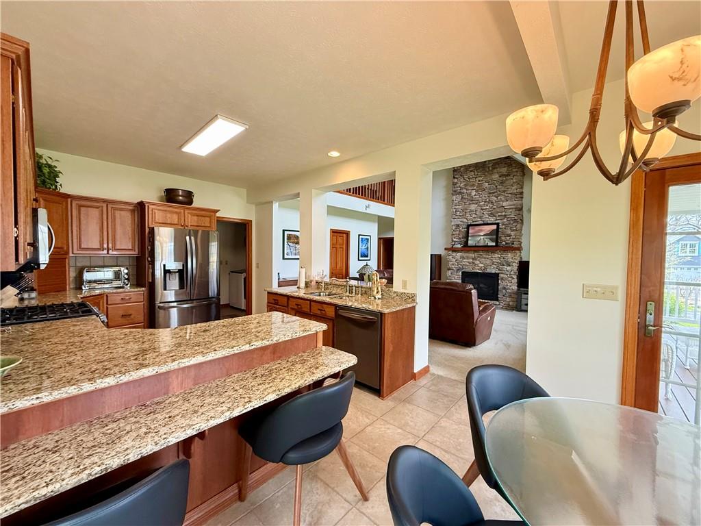 334 Manito Trail Mercer, PA 16137 - Photo 15 of 49 a living room with stainless steel appliances granite countertop furniture and a kitchen view