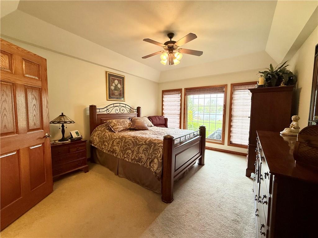 334 Manito Trail Mercer, PA 16137 - Photo 16 of 49 a bedroom with a large bed and a chandelier