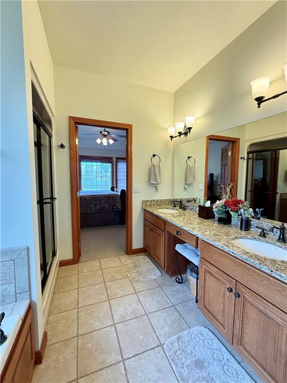 334 Manito Trail Mercer, PA 16137 - Photo 20 of 49 a spacious bathroom with a granite countertop sink mirror and bathtub