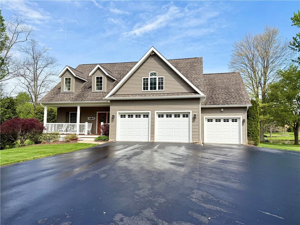 334 Manito Trail Mercer, PA 16137 - Photo 2 of 49 a front view of a house with a yard and garage