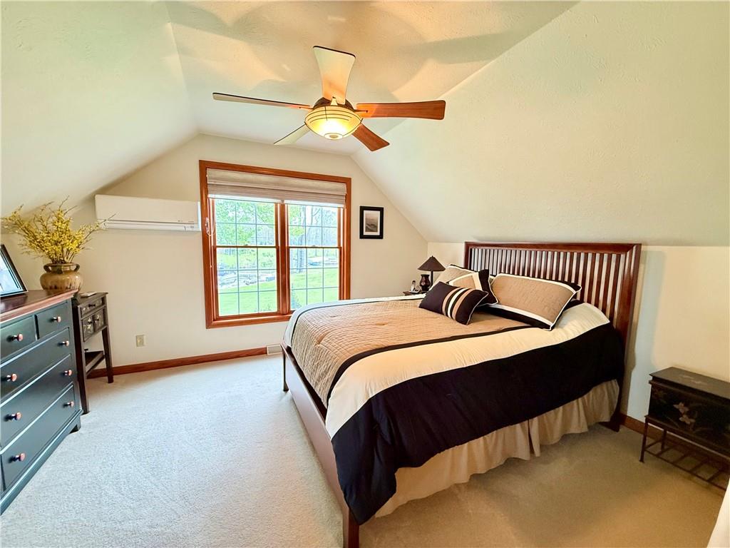 334 Manito Trail Mercer, PA 16137 - Photo 22 of 49 a bedroom with a bed and a window